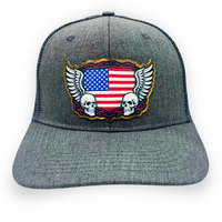 Skull and wings trucker hat with American flag patch and mesh back– unisex Americana style cap from Rustic Pines Outfitters Front View