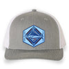 Heather Gray and White trucker hat with a detailed acrylic blue marlin patch on the front. Features a breathable mesh back and an adjustable snapback closure. The curved bill provides shade, making it perfect for fishing, boating, and coastal adventures