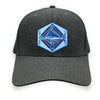 Charcoal trucker hat with a detailed acrylic blue marlin patch on the front. Features a breathable mesh back and an adjustable snapback closure. The curved bill provides shade, making it perfect for fishing, boating, and coastal adventures