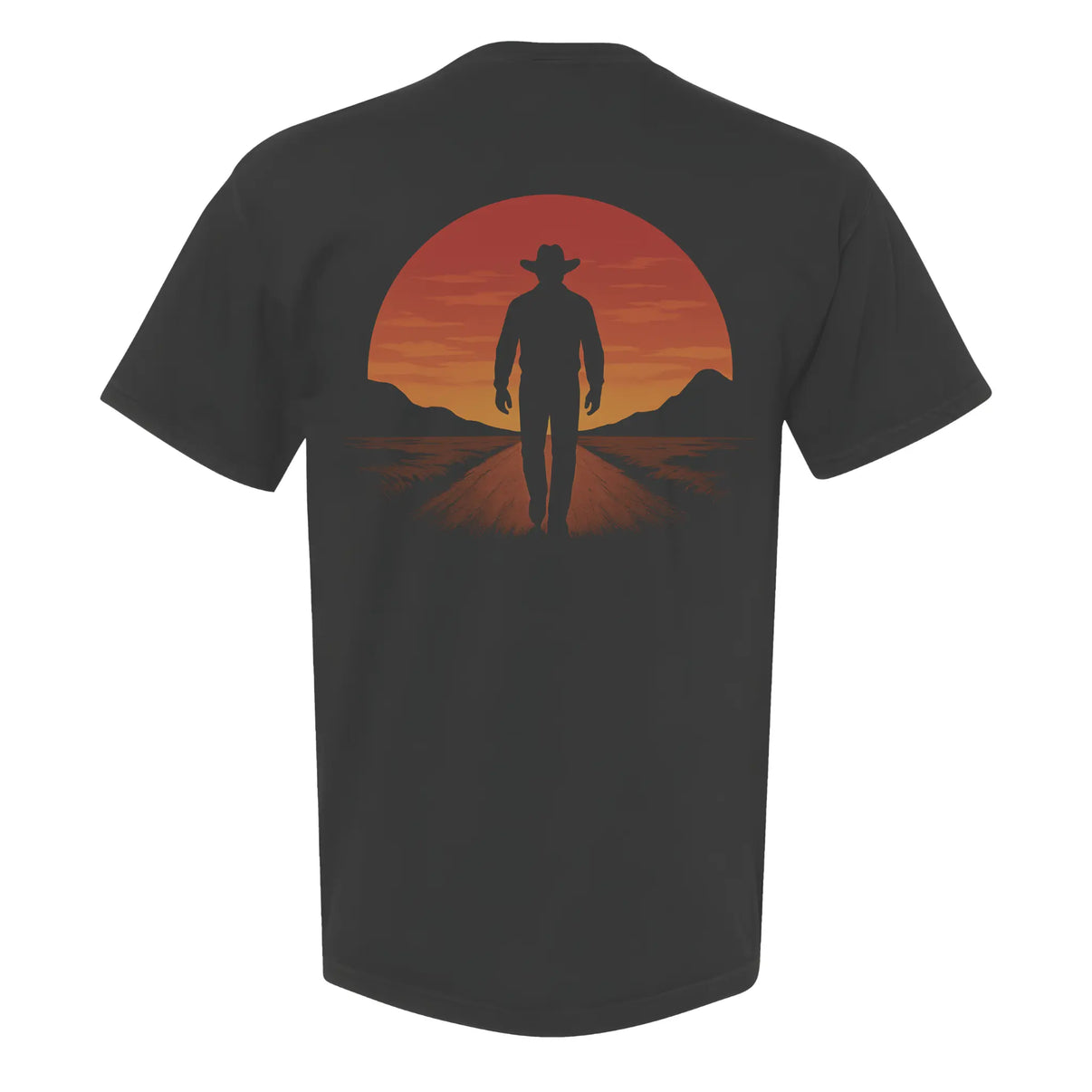 Sunset cowboy Western graphic t-shirt featuring a black silhouette of a cowboy walking away from a glowing sunset, printed on a Comfort Colors garment-dyed unisex tee with a relaxed fit.